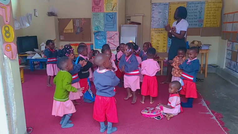 Young children with their teacher