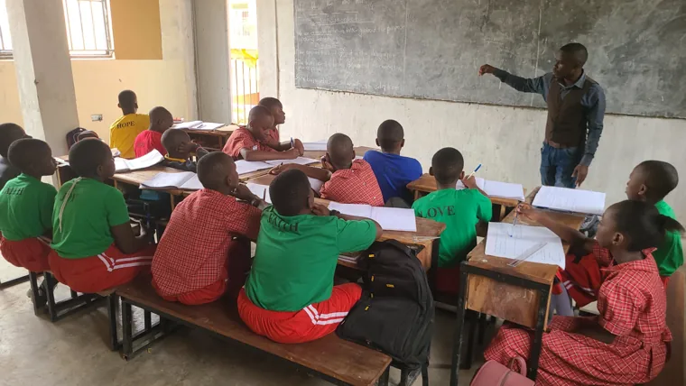 A teacher leading a primary lesson