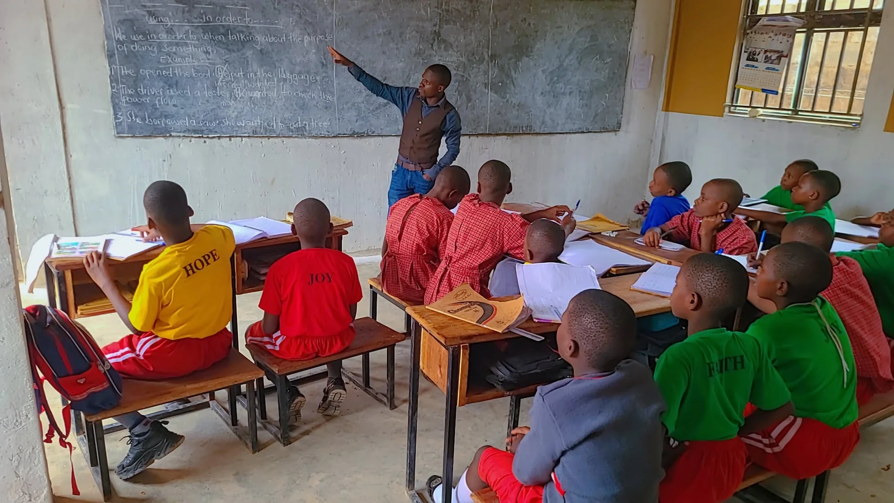 Primary pupils taking part in a lesson at the chalkboard